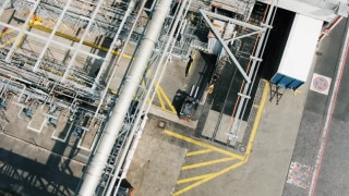 Aerial view of a factory site and a Linde MH explosion-protected forklift