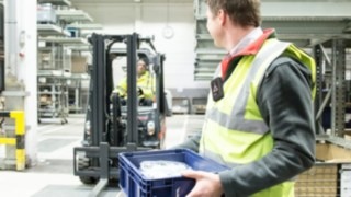 The Pedestrian Warning Band uses vibration, sound and light signals to warn its wearer of an approaching vehicle. Person on the company premises with a Pedestrian Warning Band on his body