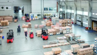 Warehouse with forklifts in operation