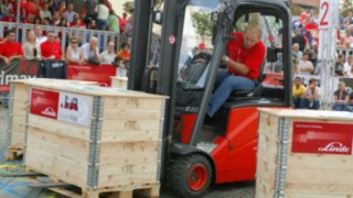 Forklift operators master the course of the 2005 Forklift Cup in a Linde Material Handling forklift truck
