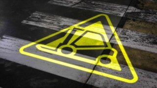 Yellow warning symbol of the stationary warning projector. Yellow warning symbol of the stationary warning projector.