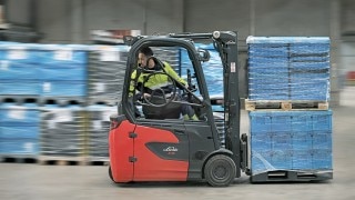 A DB Schenker employee reverses on the Linde E16 electric forklift truck A DB Schenker employee reverses on the Linde E16 electric forklift truck