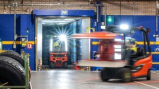 Two counterbalance forklifts Linde E20 at work in Michelin Tyre PLC´s warehouse.