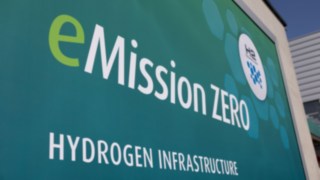 Turquoise sign with the inscription “eMission ZERO” HYDROGEN INFRASTRUCTURE