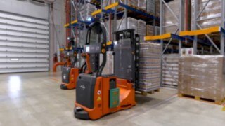 The automated L-MATIC AC counterbalanced pallet stacker in use.