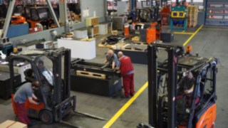 Engineers remanufacturing a certified used forklift